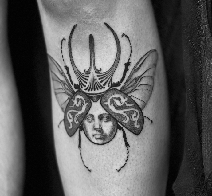 illustrative beetle tattoo in mixed styles