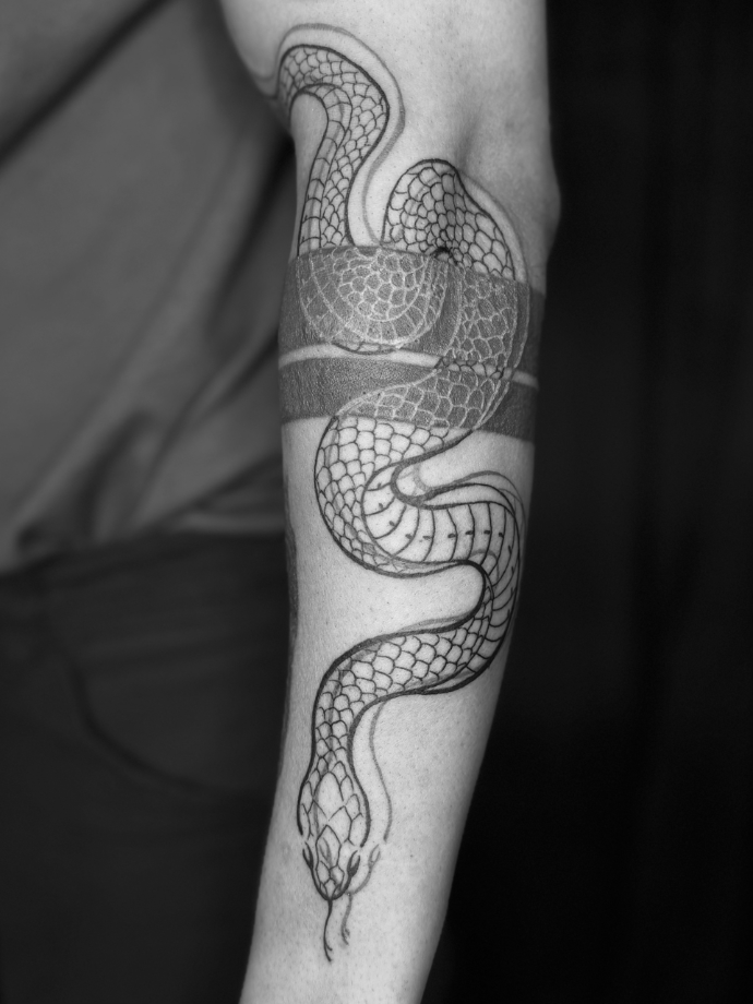 Snake tattoo in black and red