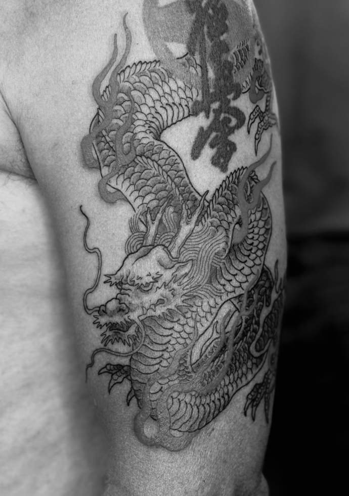 Asian dragon tattoo with red flames